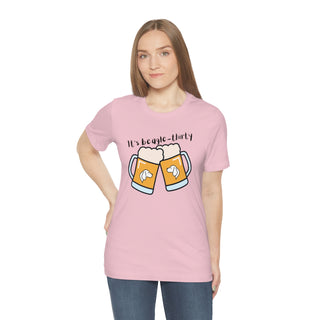 Beagle-Thirty Mugs Unisex Jersey Short Sleeve Tee in Pink. The front of shirt showcases Two Dog Adorned Mugs clinking with the saying, "It's Beagle-Thirty" above it. Back of shirt features corresponding Benefit Beagle Logo.