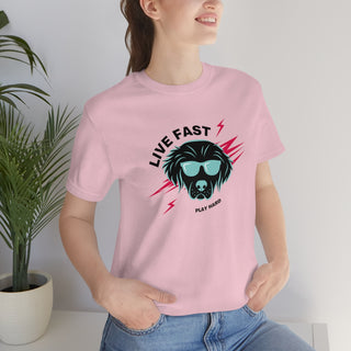 Play Hard Unisex Jersey Short Sleeve Tee Shirt in Pink. The design features a cool dog with sunglasses and lightening bolts arond it. The phrase "Live Fast, Play Hard" is around the design.