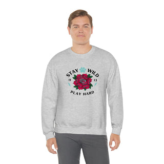 Stay Wild Unisex Heavy Blend Crewneck Sweatshirt in Ash. The Stay Wild Design features a tattoo style rose with the phrase "Stay Wild, Play Hard" around it. The back of shirt features the Stay Wild Benefit Beagle Logo Design.