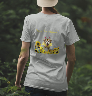 Bee Pawsitive Unisex Jersey Short Sleeve Tee shirt in Athletic Heather. Shown is back of shirt showcasing a dog dressed as as bee in a a field of sunflowers with the phrase "Bee Pawsitive!" above it. The front features the Bee Pawsitive Benefit Beagle Logo.