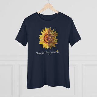 You are my Sunshine Women's Premium Tee shirt in Navy. Shown is the front showcasing a sunflower which is split down the middle and half is made out of paw prints. Underneath is the phrase "You are my Sunshine" . Back of shirt features the Sunflower Benefit Beagle Logo.