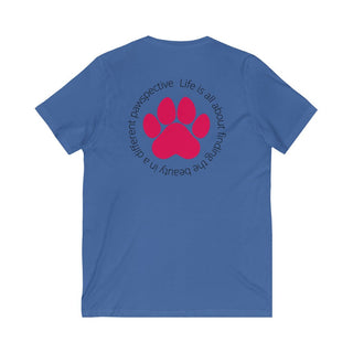 Different Pawspective Unisex V-Neck Tee in True Royal. Shown is the back of shirt featuring a large colorful pawprint with the the phrase "Life is all about finding the beauty in a different pawspective" circled around it. The Benefit Beagle Logo is located in the top corner on the front of shirt.