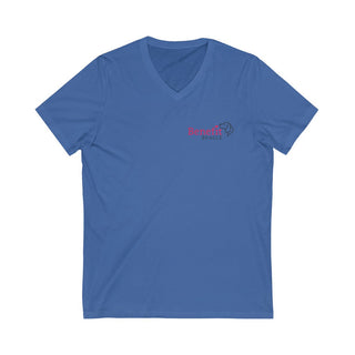 Different Pawspective Unisex V-Neck Tee in True Royal. Shown is front of shirt with Benefit Beagle logo in the top corner . On the back is large colorful pawprint with the the phrase "Life is all about finding the beauty in a different pawspective" circled around it.