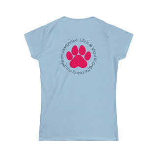 Different Pawspective Women's Softstyle Tee in Light Blue. Shown is the back of shirt featuring a large colorful pawprint with the the phrase "Life is all about finding the beauty in a different pawspective" circled around it. The Benefit Beagle Logo is located in the top corner on the front of shirt.