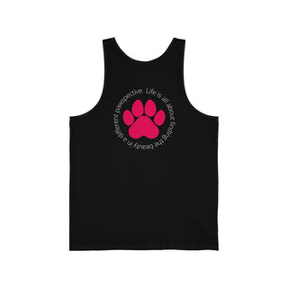 Different Pawspectives Unisex Jersey Tank in Black. Shown is the back of shirt featuring a large colorful pawprint with the the phrase "Life is all about finding the beauty in a different pawspective" circled around it. The Benefit Beagle Logo is located in the top corner on the front of shirt.