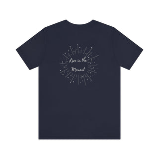 Live in the Moment Unisex Short Sleeve Tee in Navy. The Live in the Moment design features a graphic on the back with the phrase "Live in the Moment" surrounded by shooting stars.