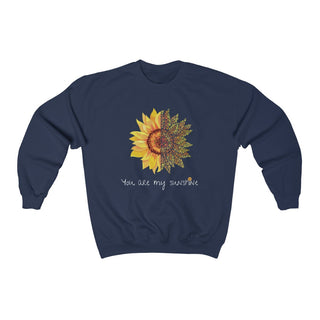 You are my Sunshine Unisex Crewneck Sweatshirt in Navy. Shown is the front showcasing a sunflower which is split down the middle and half is made out of paw prints. Underneath is the phrase "You are my Sunshine" . Back of shirt features the Sunflower Benefit Beagle Logo.