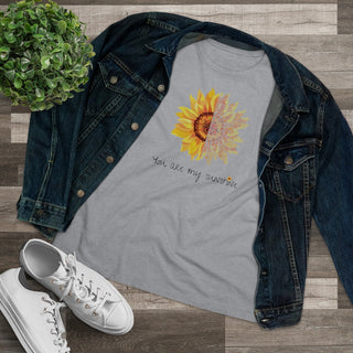 You are my Sunshine Women's Premium Tee shirt in Athletic Heather. Shown is the front showcasing a sunflower which is split down the middle and half is made out of paw prints. Underneath is the phrase "You are my Sunshine" . Back of shirt features the Sunflower Benefit Beagle Logo.