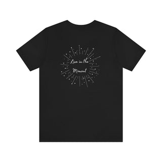 Live in the Moment Unisex Short Sleeve Tee in Black. The Live in the Moment design features a graphic on the back with the phrase "Live in the Moment" surrounded by shooting stars.