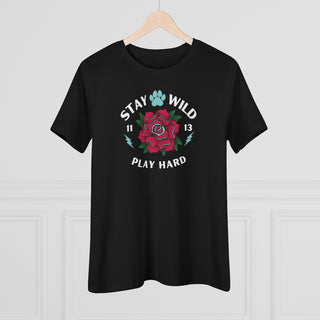 Stay Wild Women's Premium Tee in Black. Shown is front of Stay Wild Design features a tattoo style rose with the phrase "Stay Wild, Play Hard" around it. The back of shirt features the Stay Wild Benefit Beagle Logo Design.