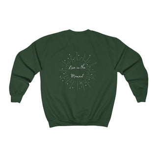 Live in the Moment Crewneck Sweatshirt in Forest Green. The Live in the Moment design features a graphic on the back with the phrase "Live in the Moment" surrounded by shooting stars.