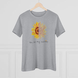 You are my Sunshine Women's Premium Tee shirt in Athletic Heather. Shown is the front showcasing a sunflower which is split down the middle and half is made out of paw prints. Underneath is the phrase "You are my Sunshine" . Back of shirt features the Sunflower Benefit Beagle Logo.