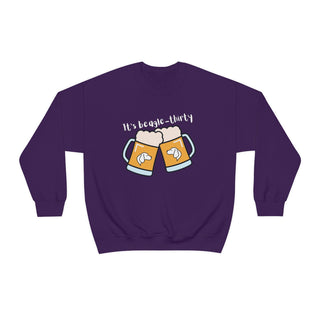 Beagle-Thirty Mugs Unisex Heavy Blend Crewneck Sweatshirt in Purple. The front of shirt showcases Two Dog Adorned Mugs clinking with the saying, "It's Beagle-Thirty" above it. Back of shirt features corresponding Benefit Beagle Logo.