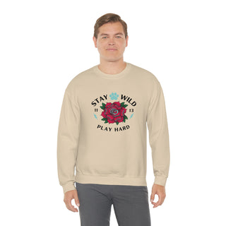 Stay Wild Unisex Heavy Blend Crewneck Sweatshirt in Sand. The Stay Wild Design features a tattoo style rose with the phrase "Stay Wild, Play Hard" around it. The back of shirt features the Stay Wild Benefit Beagle Logo Design.