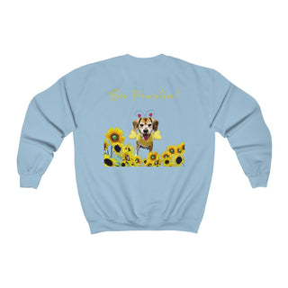 Bee Pawsitive Unisex Crewneck Sweatshirt shirt in Light Blue. Shown is back of shirt showcasing a dog dressed as as bee in a a field of sunflowers with the phrase "Bee Pawsitive!" above it. The front features the Bee Pawsitive Benefit Beagle Logo.