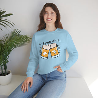 Beagle-Thirty Mugs Unisex Heavy Blend Crewneck Sweatshirt in Light Blue. The front of shirt showcases Two Dog Adorned Mugs clinking with the saying, "It's Beagle-Thirty" above it. Back of shirt features corresponding Benefit Beagle Logo.