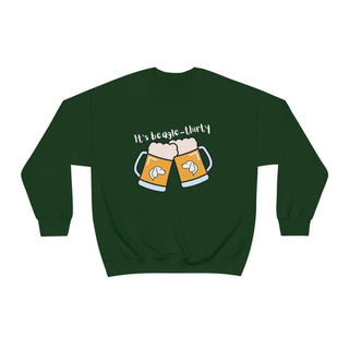 Beagle-Thirty Mugs Unisex Heavy Blend Crewneck Sweatshirt in Forest Green. The front of shirt showcases Two Dog Adorned Mugs clinking with the saying, "It's Beagle-Thirty" above it. Back of shirt features corresponding Benefit Beagle Logo.