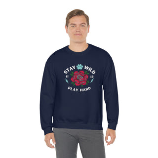 Stay Wild Unisex Heavy Blend Crewneck Sweatshirt in Navy. The Stay Wild Design features a tattoo style rose with the phrase "Stay Wild, Play Hard" around it. The back of shirt features the Stay Wild Benefit Beagle Logo Design.