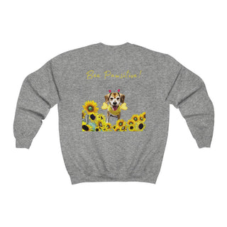 Bee Pawsitive Unisex Crewneck Sweatshirt shirt in Sport Grey. Shown is back of shirt showcasing a dog dressed as as bee in a a field of sunflowers with the phrase "Bee Pawsitive!" above it. The front features the Bee Pawsitive Benefit Beagle Logo.