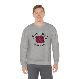 Stay Wild Unisex Heavy Blend Crewneck Sweatshirt in Sport Grey. The Stay Wild Design features a tattoo style rose with the phrase "Stay Wild, Play Hard" around it. The back of shirt features the Stay Wild Benefit Beagle Logo Design.