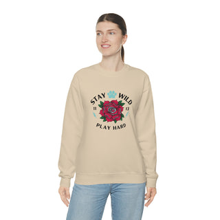 Stay Wild Unisex Heavy Blend Crewneck Sweatshirt in Sand. The Stay Wild Design features a tattoo style rose with the phrase "Stay Wild, Play Hard" around it. The back of shirt features the Stay Wild Benefit Beagle Logo Design.