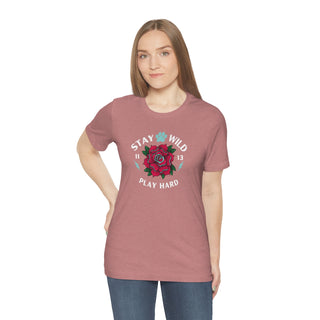 Stay Wild Unisex Premium Tee in Heather Mauve. Shown is front of Stay Wild Design features a tattoo style rose with the phrase "Stay Wild, Play Hard" around it. The back of shirt features the Stay Wild Benefit Beagle Logo Design.