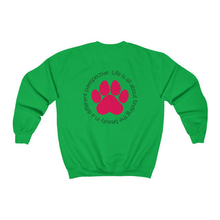 Different Pawspective Unisex Crewneck Sweatshirt in Irish Green. Shown is the back of shirt featuring a large colorful pawprint with the the phrase "Life is all about finding the beauty in a different pawspective" circled around it. The Benefit Beagle Logo is located in the top corner on the front of shirt.