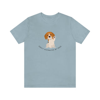 Easily Distracted Unisex Jersey Short Sleeve Tee in Light Blue. Shown is front design featuring a dog waving with the saying "Easily Distracted by Dogs" below it. The back of shirt has the classic Benefit Beagle Logo.