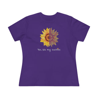 You are my Sunshine Women's Premium Tee shirt in Purple. Shown is the front showcasing a sunflower which is split down the middle and half is made out of paw prints. Underneath is the phrase "You are my Sunshine" . Back of shirt features the Sunflower Benefit Beagle Logo.