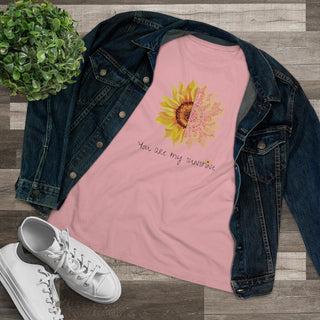 You are my Sunshine Women's Premium Tee shirt in Pink. Shown is the front showcasing a sunflower which is split down the middle and half is made out of paw prints. Underneath is the phrase "You are my Sunshine" . Back of shirt features the Sunflower Benefit Beagle Logo.