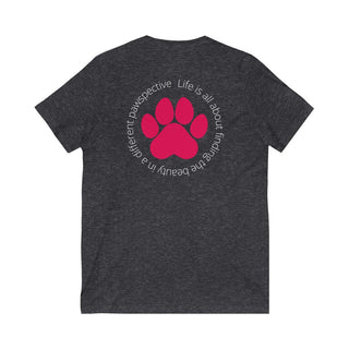 Different Pawspective Unisex V-Neck Tee in Dark Grey Heather. Shown is the back of shirt featuring a large colorful pawprint with the the phrase "Life is all about finding the beauty in a different pawspective" circled around it. The Benefit Beagle Logo is located in the top corner on the front of shirt.