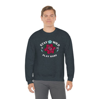 Stay Wild Unisex Heavy Blend Crewneck Sweatshirt in Dark Grey Heather. The Stay Wild Design features a tattoo style rose with the phrase "Stay Wild, Play Hard" around it. The back of shirt features the Stay Wild Benefit Beagle Logo Design.