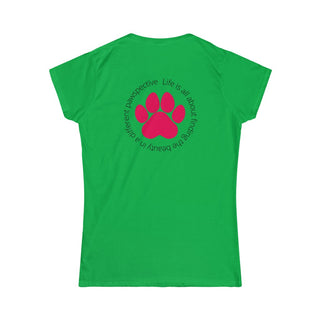 Different Pawspective Women's Softstyle Tee in Irish Green. Shown is the back of shirt featuring a large colorful pawprint with the the phrase "Life is all about finding the beauty in a different pawspective" circled around it. The Benefit Beagle Logo is located in the top corner on the front of shirt.