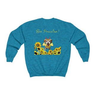 Bee Pawsitive Unisex Crewneck Sweatshirt shirt in Antique Sapphire. Shown is back of shirt showcasing a dog dressed as as bee in a a field of sunflowers with the phrase "Bee Pawsitive!" above it. The front features the Bee Pawsitive Benefit Beagle Logo.