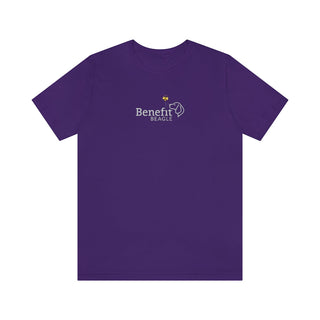 Bee Pawsitive Unisex Jersey Short Sleeve Tee in Team Purple. The front of shirt features the Bee Pawsitive Benefit Beagle Logo. The back of shirt showcases a dog dressed as a bee in a field of sunflowers with "Bee Pawsitive" written above.