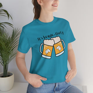 Beagle-Thirty Mugs Unisex Jersey Short Sleeve Tee in Aqua. The front of shirt showcases Two Dog Adorned Mugs clinking with the saying, "It's Beagle-Thirty" above it. Back of shirt features corresponding Benefit Beagle Logo.