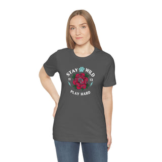 Stay Wild Unisex Premium Tee in Asphalt. Shown is front of Stay Wild Design features a tattoo style rose with the phrase "Stay Wild, Play Hard" around it. The back of shirt features the Stay Wild Benefit Beagle Logo Design.