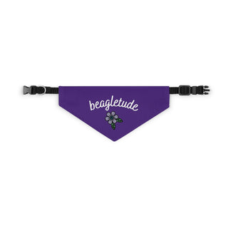 The Signature Tattoo Flower Dog Collar Bandana in Purple. The Signature Tattoo Flower design features the word "beagletude" with a tattoo style flower under it. Comes with adjustable black collar.