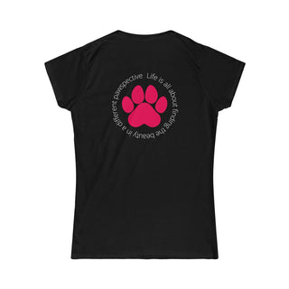 Different Pawspective Women's Softstyle Tee in Black. Shown is the back of shirt featuring a large colorful pawprint with the the phrase "Life is all about finding the beauty in a different pawspective" circled around it. The Benefit Beagle Logo is located in the top corner on the front of shirt.