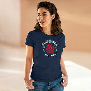 Stay Wild Women's Midweight Cotton Tee in Navy. Shown is front of Stay Wild Design features a tattoo style rose with the phrase "Stay Wild, Play Hard" around it. The back of shirt features the Stay Wild Benefit Beagle Logo Design.