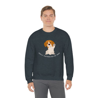 Easily Distracted Unisex Heavy Blend Crewneck Sweatshirt in Dark Heather. Shown is front design featuring a dog waving with the saying "Easily Distracted by Dogs" below it. The back of shirt has the classic Benefit Beagle Logo.