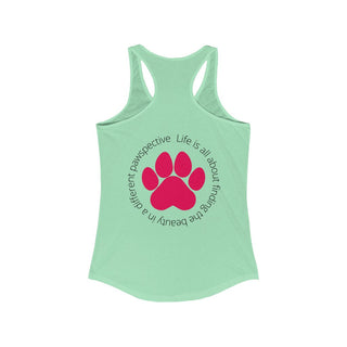 Different Pawspective Women's Racerback Tank in Mint. Shown is the back of shirt featuring a large colorful pawprint with the the phrase "Life is all about finding the beauty in a different pawspective" circled around it. The Benefit Beagle Logo is located in the top corner on the front of shirt.