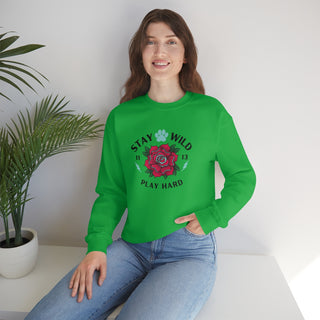 Stay Wild Unisex Heavy Blend Crewneck Sweatshirt in Irish Green. The Stay Wild Design features a tattoo style rose with the phrase "Stay Wild, Play Hard" around it. The back of shirt features the Stay Wild Benefit Beagle Logo Design.