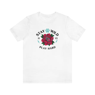 Stay Wild Unisex Premium Tee in White. Shown is front of Stay Wild Design features a tattoo style rose with the phrase "Stay Wild, Play Hard" around it. The back of shirt features the Stay Wild Benefit Beagle Logo Design.