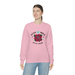 Stay Wild Unisex Heavy Blend Crewneck Sweatshirt in Pink. The Stay Wild Design features a tattoo style rose with the phrase "Stay Wild, Play Hard" around it. The back of shirt features the Stay Wild Benefit Beagle Logo Design.