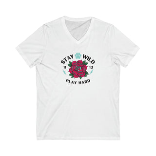 Stay Wild Unisex Jersey Short Sleeve V-Neck Tee in White. The Stay Wild Design features a tattoo style rose with the phrase "Stay Wild, Play Hard" around it. The back of shirt features the Stay Wild Benefit Beagle Logo Design.