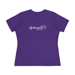 Adventures Await Women's Premium Tee in Purple. Shown is the back of shirt with a Nautical Compass Benefit Beagle Logo. The front of shirt features the Adventures Await design with a dog inside a nautical compass and the words "Adventures Await" above it.