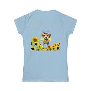 Bee Pawsitive Women's Softstyle Tee in Light Blue. Shown is back of shirt showcasing a dog dressed as as bee in a a field of sunflowers with the phrase "Bee Pawsitive!" above it. The front features the Bee Pawsitive Benefit Beagle Logo.