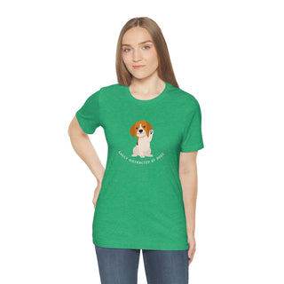 Easily Distracted Unisex Jersey Short Sleeve Tee in Heather Kelly. Shown is front design featuring a dog waving with the saying "Easily Distracted by Dogs" below it. The back of shirt has the classic Benefit Beagle Logo.