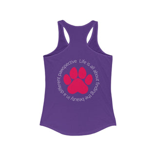 Different Pawspective Women's Racerback Tank in Purple Rush. Shown is the back of shirt featuring a large colorful pawprint with the the phrase "Life is all about finding the beauty in a different pawspective" circled around it. The Benefit Beagle Logo is located in the top corner on the front of shirt.